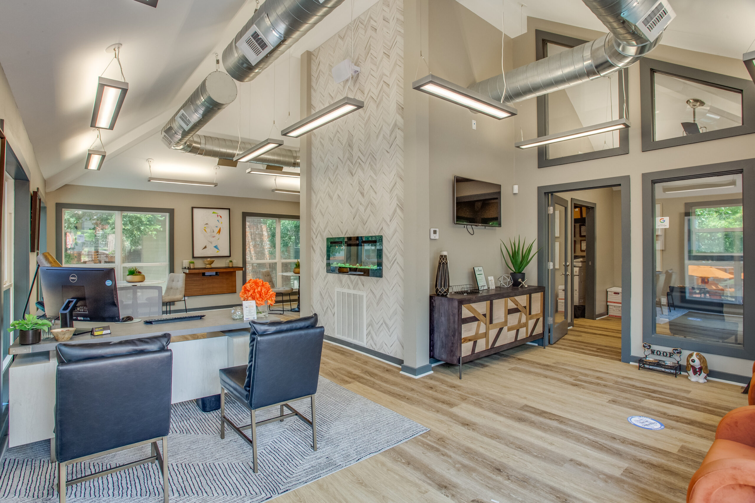 resident center with high ceilings and wood-look flooring