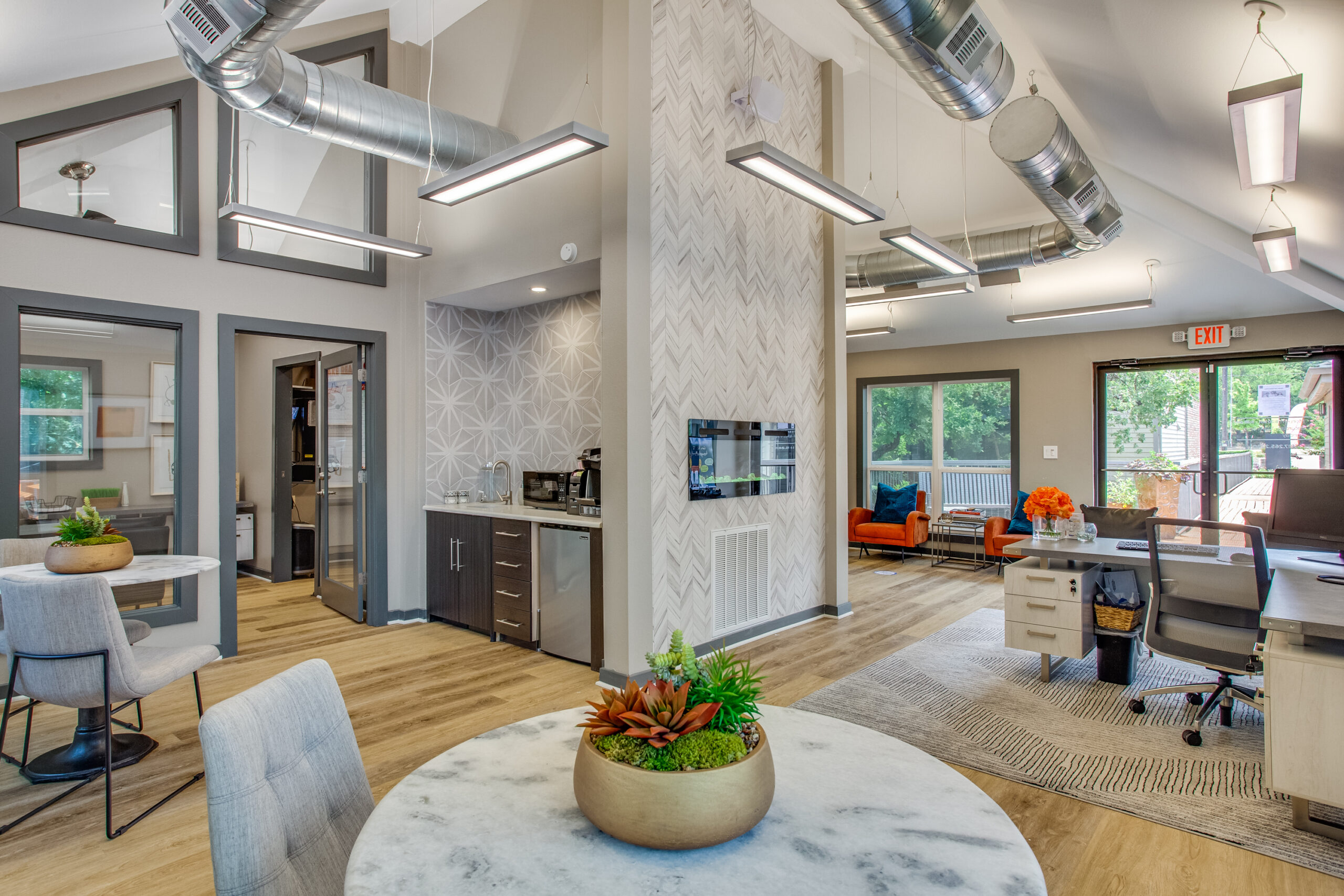 resident center with high ceilings and wood-look flooring